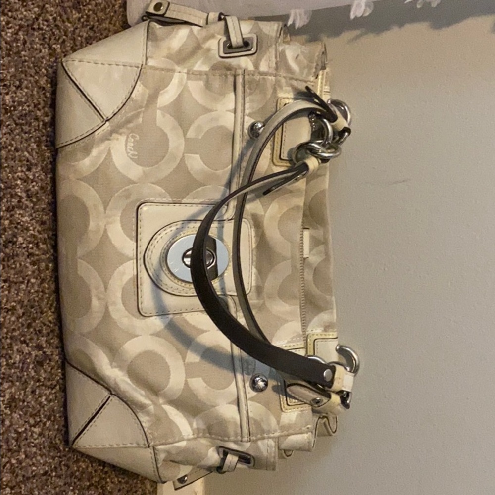 Coach bag white logo with leather accents.